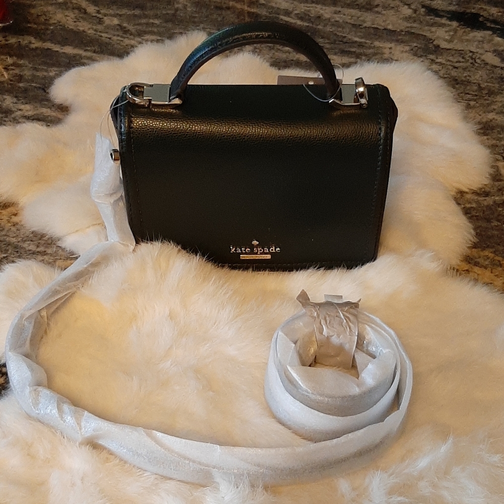 NWT Kate Spade New York  Cross body
With a few little marks on the front